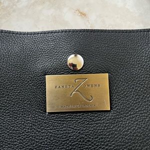 Black leather tote purse by Zaneta Owens.